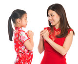 Chinese parent and child greeting to each other