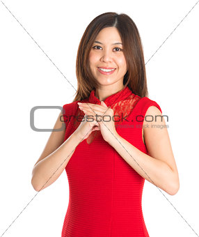 Asian woman respecting on Chinese New Year Festival.