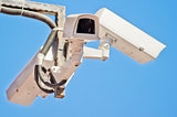 Three outdoor video surveillance camera on the bracket.