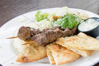 Lamb Kebab with Rice Naan and Salad Closeup