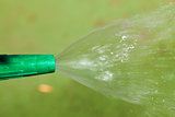 Watering plants and grass by nozzle