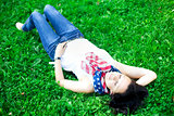 Beautiful girl lying on a grass