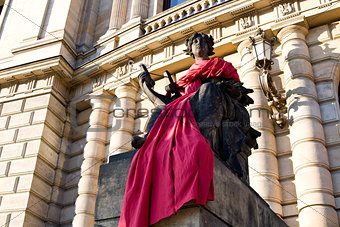 Statue near the Opera House in red cloth, Prague, Czech Republic