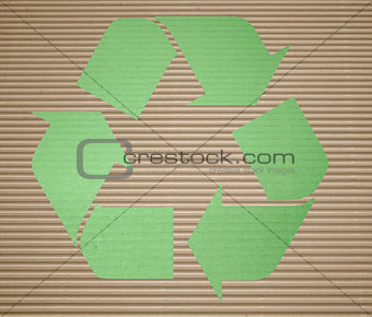 Green recycling on corrugated cardboard with background 