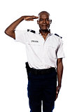 Portrait of police officer saluting