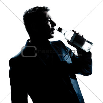 silhouette man drunk pouring empty alcohol botlle