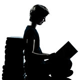 one caucasian young teenager silhouette boy or girl reading