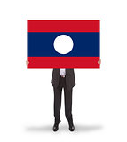 Businessman holding a big card, flag of Laos