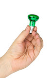 Hand hold tiny green spot tungsten lightbulb