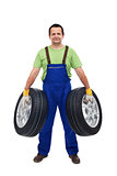 Car mechanic with two tires