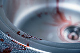 Close-up shot of blood on kitchen sink 