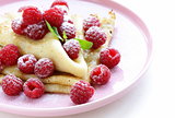 pancakes (crepes) with raspberries and mint -  healthy breakfast
