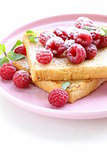 fresh toasted toast with raspberries and powdered sugar