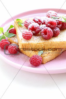 fresh toasted toast with raspberries and powdered sugar
