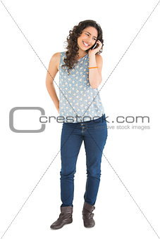 Cheerful attractive brunette on the phone