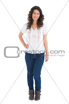 Cheerful attractive brunette wearing casual clothes posing