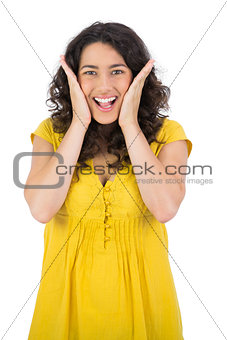 Surprised casual young woman posing