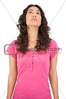 Pensive brown haired woman posing