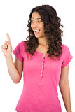 Smiling brown haired woman finger up