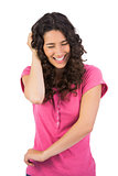 Laughing brown haired woman gesturing