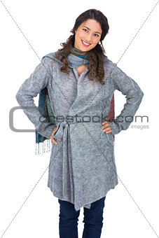 Cheerful pretty brunette wearing winter clothes posing