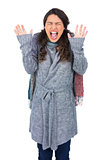 Young pretty model with winter clothes shouting