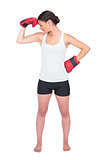 Healthy model with boxing gloves posing
