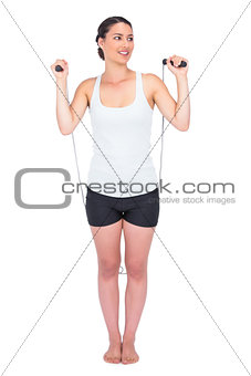 Cheerful slender model jumping rope