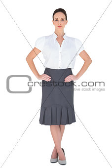 Unsmiling attractive businesswoman posing