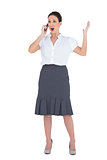 Angry businesswoman having a phone call