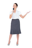 Cheerful presenter holding microphone