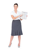 Happy classy businesswoman holding newspaper