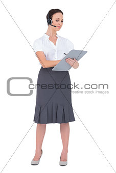 Focused call center agent holding clipboard