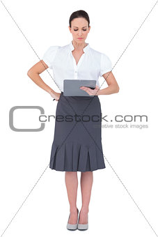 Focused businesswoman looking at her memo