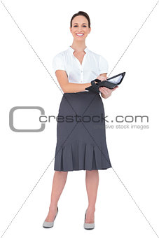 Smiling businesswoman holding her datebook