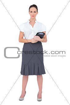 Content businesswoman holding datebook