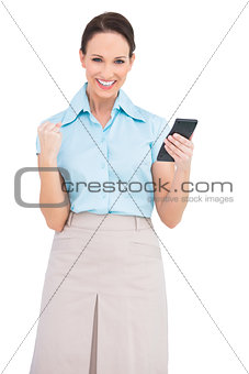 Successful classy businesswoman using calculator