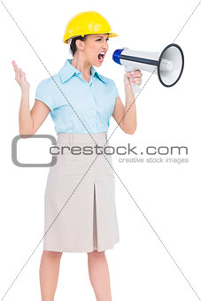 Stern attractive architect yelling in megaphone
