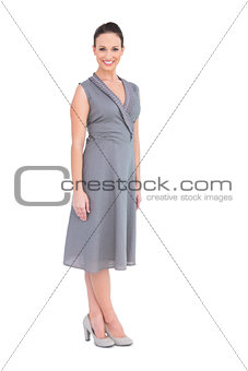 Happy elegant woman in classy dress posing