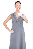Cheerful seductive woman holding business card
