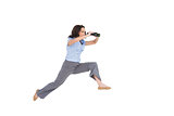 Cheerful classy businesswoman jumping while holding binoculars