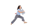 Cheerful classy businesswoman jumping while holding clipboard