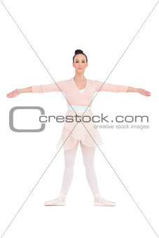 Cheerful gorgeous ballerina posing for camera