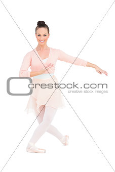 Smiling attractive ballerina posing