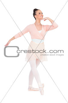 Happy attractive ballerina posing looking away