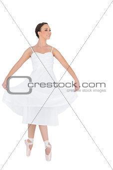 Happy young ballet dancer isolated