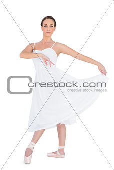 Serious young ballet dancer posing