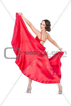 Smiling gorgeous woman dancing flamenco