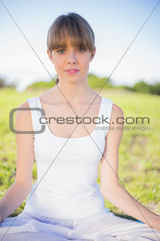 Relaxed natural young woman doing yoga