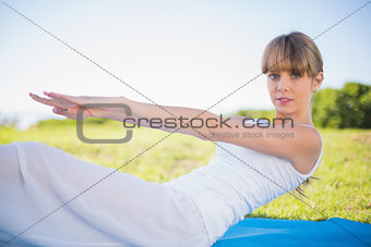 Natural young woman exercising outside